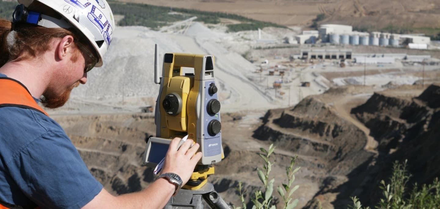 GPS Alaska worker with Topcon equipment on construction site