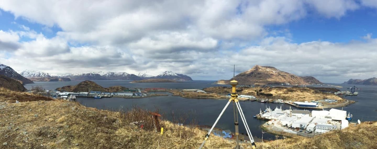 Alaska mountains with survey equipment